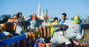 Guests soar on Dumbo the Flying Elephant at Magic Kingdom, Cinderella Castle creating a picture-perfect Disney backdrop.