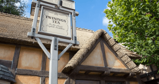 Discover the Twinings of London sign welcoming guests outside a charming, storybook-style cottage with timber beams and thatched roof.