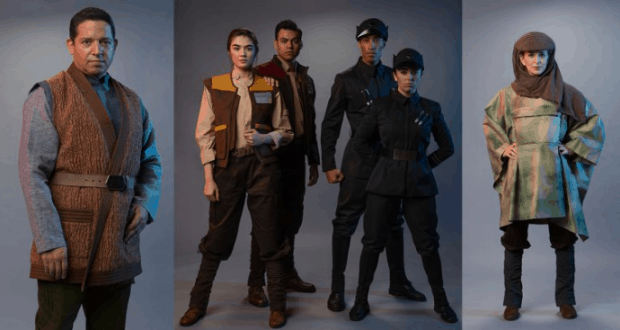 Star Wars characters pose in immersive Galaxy's Edge cast member costumes against a sleek gray backdrop, ready for adventure.
