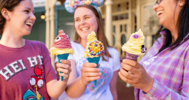Three friends enjoying vibrant, candy-topped ice cream cones at Magic Kingdom—ultimate Disney foodie fun in the heart of the park.