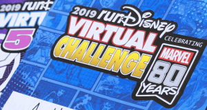 2019 runDisney Virtual Series sign honoring Marvel's 80 Years, set in a lively blue comic backdrop—perfect for Disney fans.