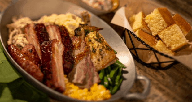 Whispering Canyon Cafe skillet: barbecue meats, green beans, corn, and cornbread—a must-try for hungry Disney fans.