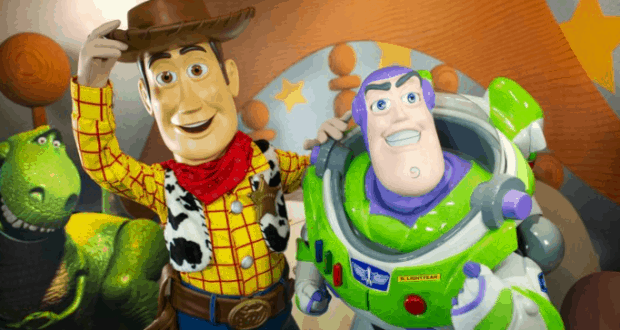Woody and Buzz Lightyear greet fans with big smiles at Woody’s Roundup Barbecue Buffet in Disney World, ready for July 4th fun.