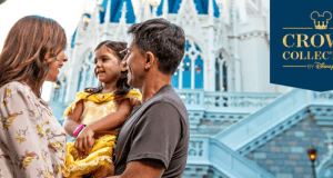 Happy family poses in front of Cinderella Castle at Walt Disney World, next to a “Crown Collection by Disney” sign.