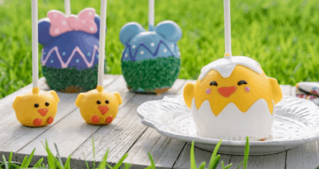 Easter-themed chick and egg cake pops in the Walt Disney World Foodie Guide, showcased outdoors on a wooden table.