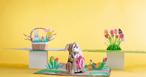 Festive Disney World Easter pop-up card with bunny, basket, flowers, and butterfly on yellow—magical spring park fun!.