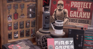 First Order display at Star Wars: Galaxy’s Edge with exclusive mugs, badges, signs, and a bold “Protect the Galaxy” poster.