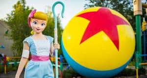 Bo Peep poses beside the iconic Pixar ball, bringing Toy Story 4 magic to Walt Disney World’s merchandise scene.