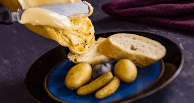 Golden, gooey cheese cascades over bread, potatoes, and pickles—just like a savory treat at Epcot’s Food & Wine Festival.