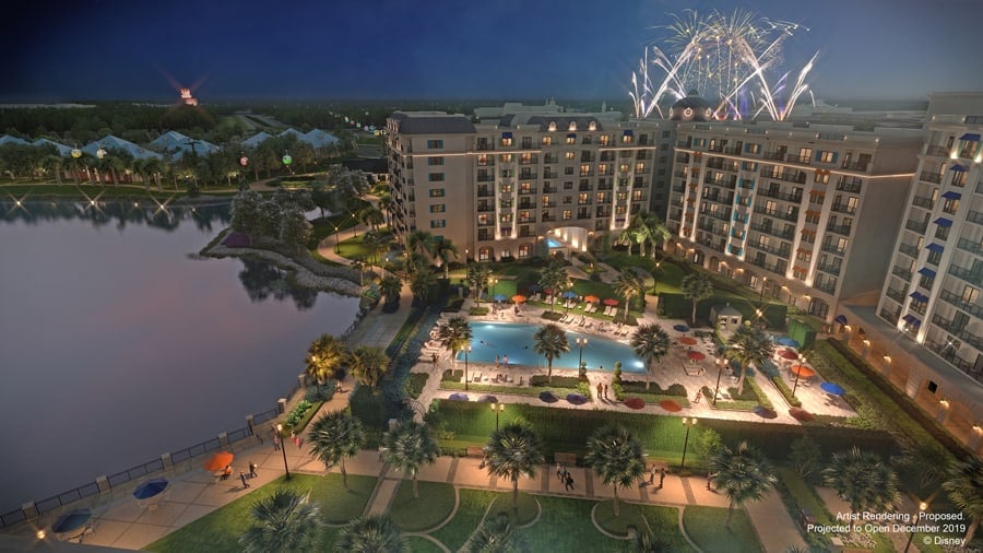 Dazzling fireworks burst above a resort pool and palm trees, with views of Disney World nearby—ideal for epic New Year's celebrations.