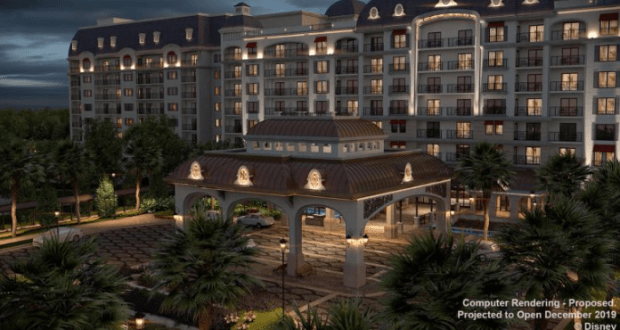 Disney’s Riviera Resort shines at night with its grand entrance, glowing arches, balconies, and palm trees at Walt Disney World.