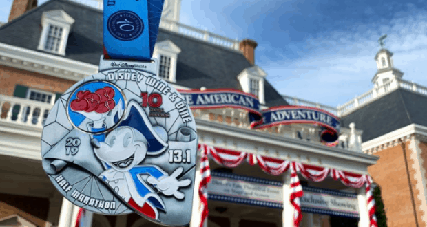 RunDisney Wine & Dine Half Marathon medal showcased in front of The American Adventure at EPCOT, celebrating Disney magic.