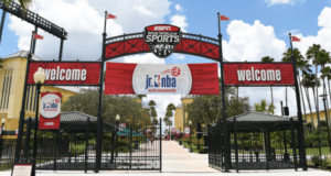ESPN Wide World of Sports entrance at Walt Disney World, featuring festive "Welcome" signs and a 2019 Jr. NBA banner.