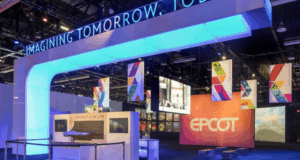 EPCOT booth glows with vivid lights and “IMAGINING TOMORROW, TODAY” signs, unveiling Disney World’s upcoming attractions.