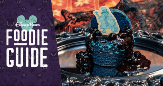 Blueberry dessert with a ghost-shaped topper on a silver tray, celebrating Haunted Mansion's 50th at Disneyland Park.