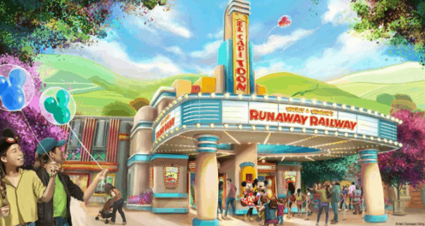 Guests gather with balloons at the vibrant Mickey & Minnie’s Runaway Railway entrance in Disneyland’s Toontown.