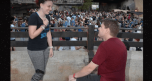 A man proposes to his surprised partner at Star Wars: Galaxy’s Edge, delighting fans with a romantic Disney World moment.