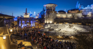 Guests explore the impressive Millennium Falcon at Star Wars: Galaxy’s Edge in Disney World during Extra Magic Hours at night.