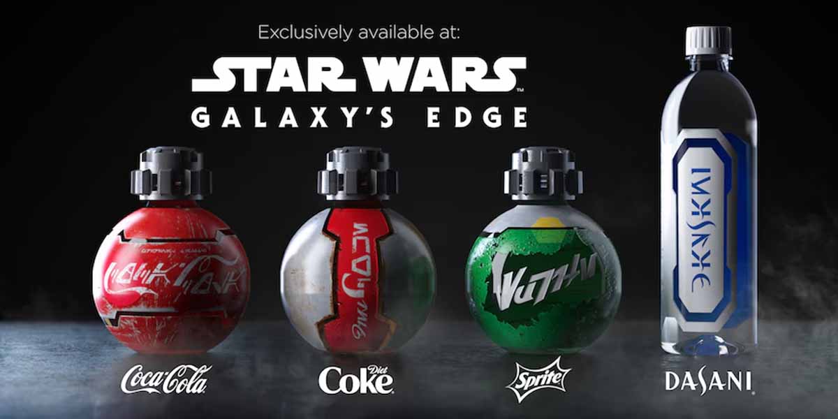 Four Star Wars-themed drink bottles—Coca-Cola, Diet Coke, Sprite, and Dasani—feature unique spherical designs and Aurebesh text, highlighting exclusive Star Wars: Galaxy’s Edge Food found only at the immersive park experience.