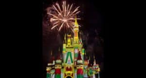 Dazzling fireworks burst over Cinderella Castle, illuminating the sky during Minnie's Wonderful Christmastime Fireworks at Disney World.