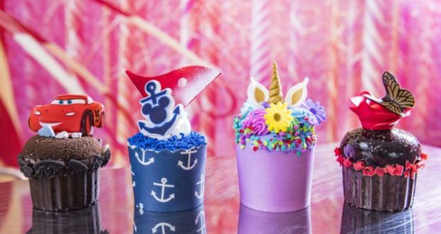 Race car, anchor, unicorn, and rose with butterfly cupcakes shimmer on display, capturing Disney Fantasy and Dream magic.