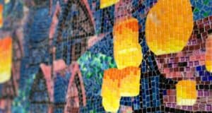 Vibrant abstract mosaic in yellow, orange, blue, green, purple, and black tiles inspired by Disney’s Riviera Resort decor.