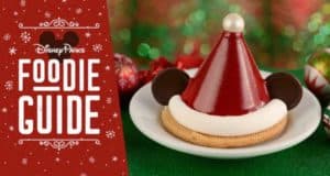 Mickey Mouse Santa hat dessert at Disney’s Hollywood Studios, displayed by the Foodie Guide sign for Holidays 2019 celebration.