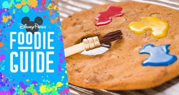 Disney Foodie Guide logo with a decorated cookie, paintbrush, and blue splatter celebrates Epcot Festival of the Arts 2020.