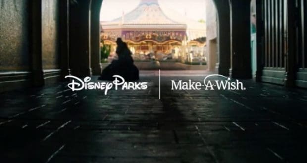 Disney and Make-A-Wish logos blend above a classic carousel, seen from a shaded walkway—iconic park magic for families.