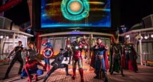 Avengers assemble on the Disney Cruise Line ship deck at night, illuminated by a glowing screen during Marvel Day at Sea.
