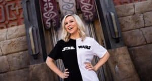 Her Universe Star Wars fan smiling confidently and posing hands-on-hips, ready for a day at Galaxy’s Edge.