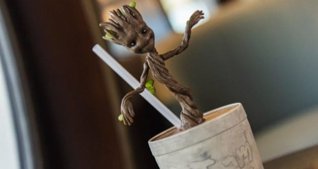Groot waves from a themed drink cup with straw—fun Marvel Day at Sea hero drinkware for theme park fans and collectors.
