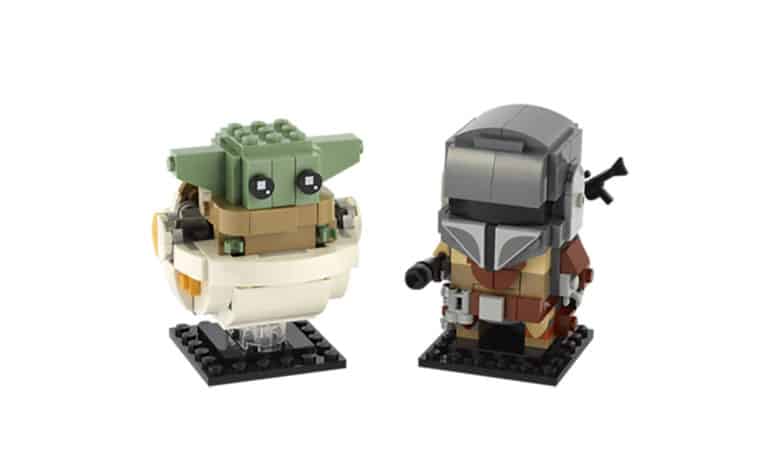 LEGO brick figures of The Mandalorian and Grogu on display bases—Star Wars collectibles perfect for theme park souvenir shops.
