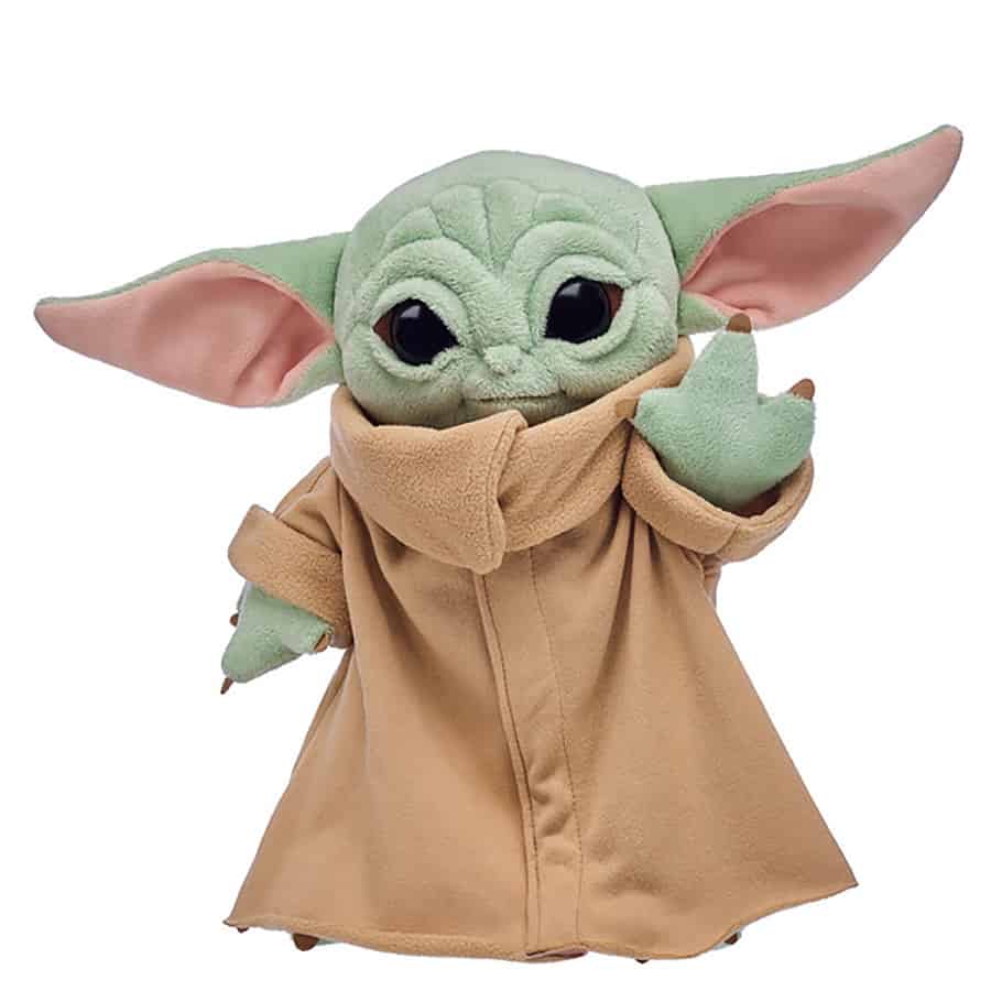 Grogu plush from Star Wars: Galaxy’s Edge, dressed in a tan robe with one hand raised, ready for your next adventure.