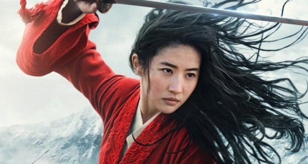 A Disney heroine in a flowing red robe wields her sword, hair flying as she poses heroically under stormy theme park skies.