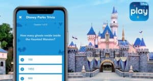 Play Disney Parks App featuring Disney Trivia lights up on a phone before Sleeping Beauty Castle, "play" logo in the corner.