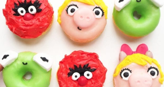 Whimsical donuts styled as Muppet Babies, featuring Piggy with bows and Kermit’s bright eyes—perfect for a theme park treat.