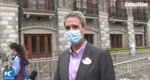 Shanghai Disneyland welcomes guests again on May 11, as seen in XinhuaVideo of a suited visitor masked outside the iconic entrance.