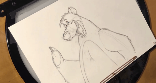 Baloo from The Jungle Book, sketched in pencil on white paper atop a drawing board—ideal inspiration for Disney fans and artists.