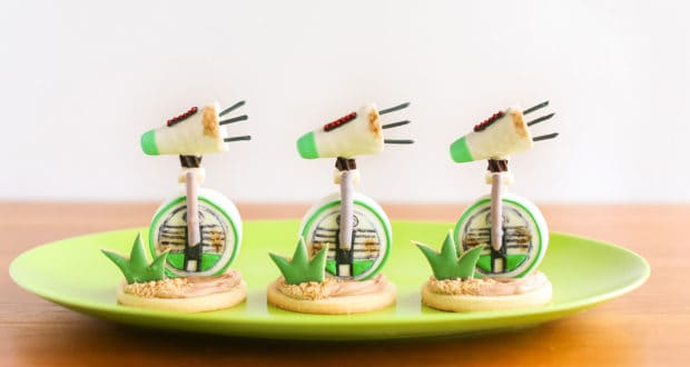 Plants vs. Zombies Peashooter cookies, inspired by D-O Cookie recipe, displayed on a green plate—perfect for theme park fans!.