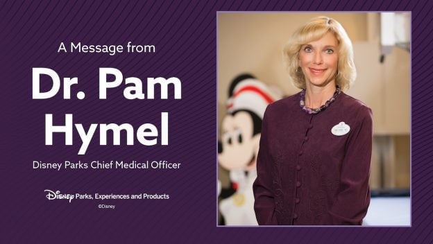 Dr. Pam Hymel smiles as Disney Parks’ Chief Medical Officer in an official update, with Mickey Mouse blurred in the background.
