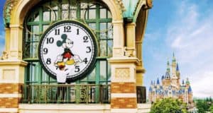 Mickey Mouse adjusts a giant clock on a balcony near Shanghai Disneyland's fairytale castle, revealing exclusive behind-the-scenes magic.