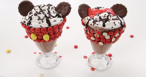 Mickey and Minnie Mouse-inspired sundaes topped with candy, whipped cream, and cookies—perfect Disney park-style milkshake treats!.