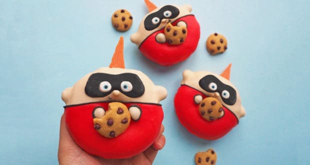 Superhero donuts inspired by the Jack-Jack Donut recipe, each holding cookies, with mini chocolate chip cookies all around.