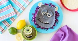 Sulley and Mike Wazowski from Monsters, Inc. crafted with fruits and veggies, served up theme-park style for fans to enjoy!.