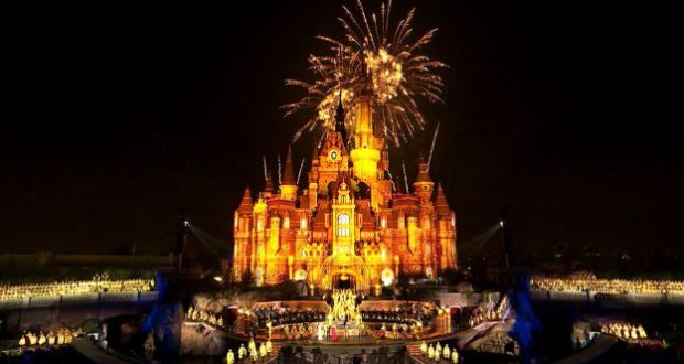Shanghai Disney Resort’s Enchanted Storybook Castle shines at night as fireworks burst above, celebrating the Grand Opening Gala.