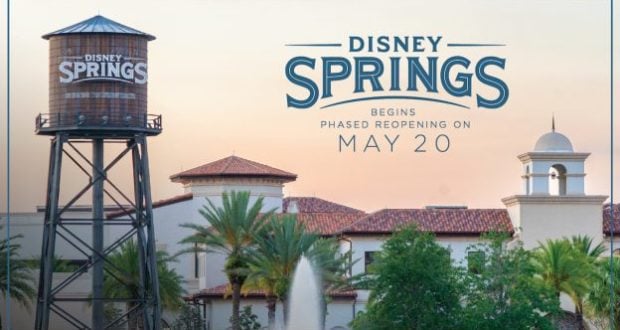 Disney Springs water tower and lively shops, with a sign welcoming guests back for the phased reopening starting May 20.