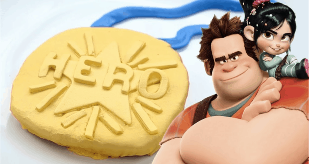 The Hero Medal Cookie gleams beside Ralph and Vanellope, star characters from Wreck-It Ralph at Disney Parks.