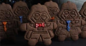Darth Vader-shaped chocolate cookies with colorful icing ties and bowties, perfect for Star Wars fans at Galaxy's Edge.