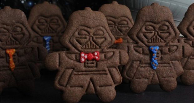 Darth Vader-shaped chocolate cookies with colorful icing ties and bowties, perfect for Star Wars fans at Galaxy's Edge.